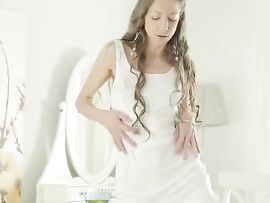 Skinny Brunette Teen Enjoys Doing A Slow Striptease