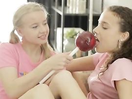Teens Licks A Huge Lollipop While Being Fingered